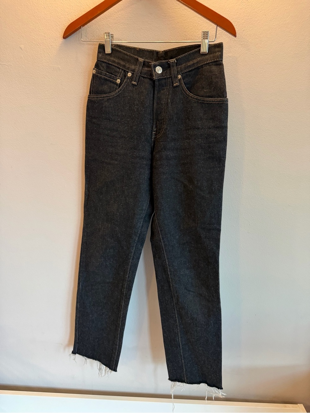 Levi's Dark Wash Denim Jeans‎ with Tan Leather Patch raw hem size 24